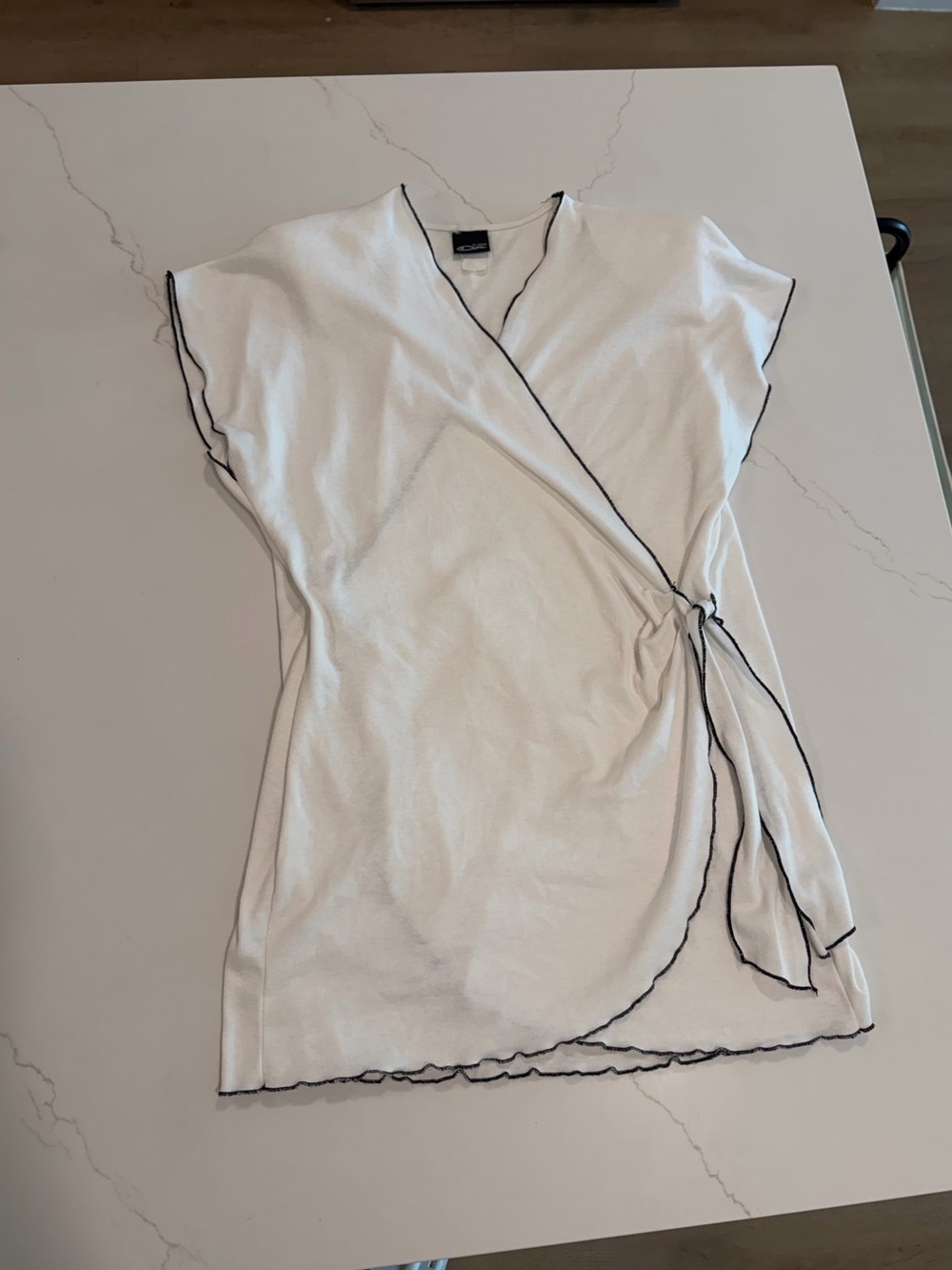 White Wrap-Style Women's Top with Black Trim